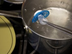 How to clean and sanitize a pacifier in boiling water.