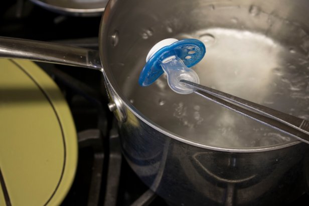 How to clean and sanitize a pacifier in boiling water.