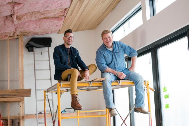Hosts Luke Caldwell and Clint Robertson, pause and pose for a picture while working on kitchen cabinets, as seen on HGTV's Restoring Idaho located in Boise, Idaho.