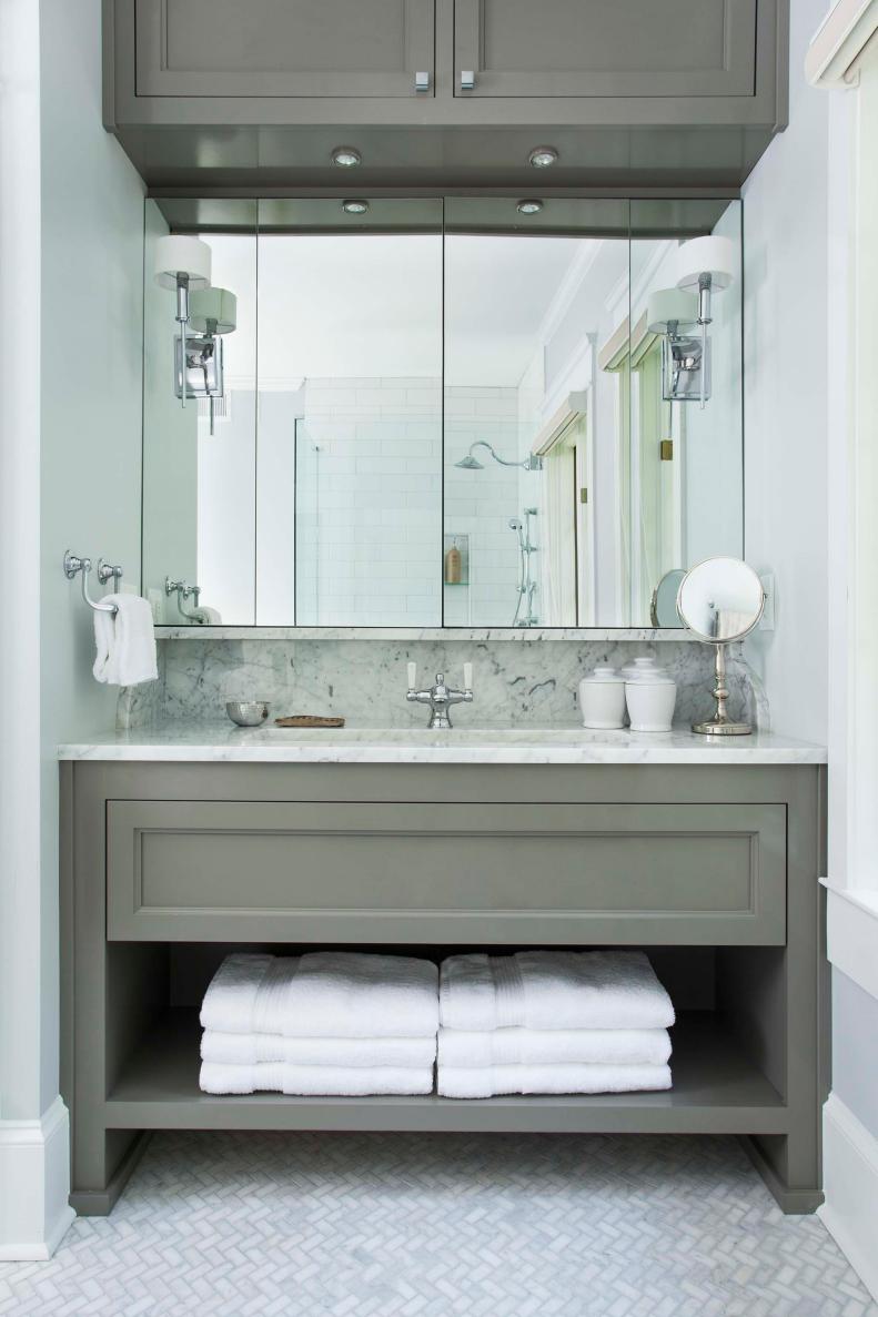 Are you looking to tone down your powder room, try grey and whites.