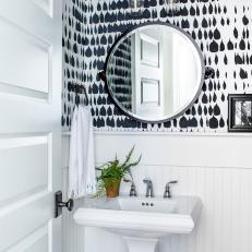 Powder Room With Graphic Black-and-White Wallpaper