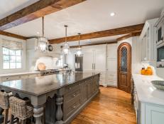 transitional kitchen with rustic wood beams
