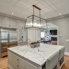 Gray Transitional Chef Kitchen With Marble Countertop