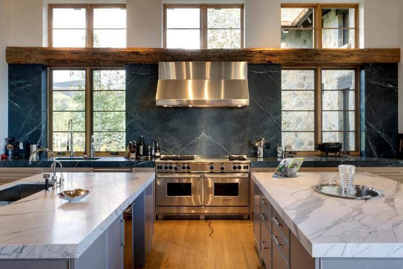 Dual Gray Islands With Marble Tops Dominate Open Kitchen
