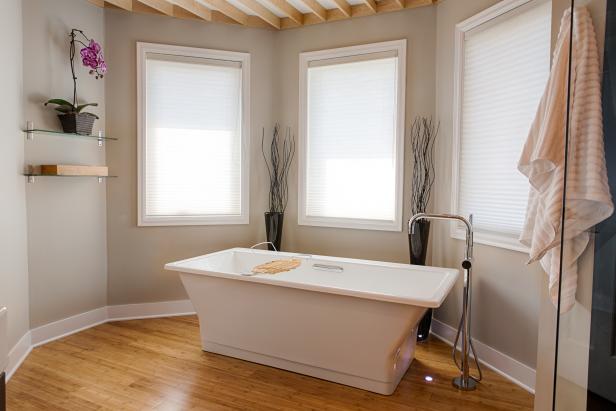 The finished bathroom in the Moon home, has a minimal modern contemporary feel, featuring ceiling beams to add a dynamic quality to the space. The modern hung wall vanities, freestanding tub and fixtures add a simple yet pleasing look, as seen on DIY Network’s, I Hate My Bath. After #5, (After)