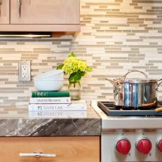 Condo Kitchen in Neutral Tones With Mosaic Backsplash