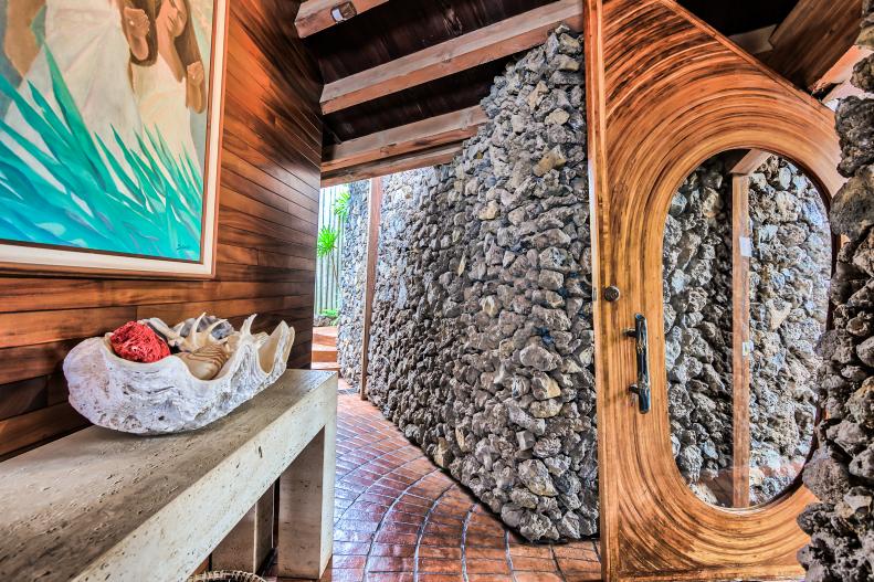 tropical foyer with rock accent wall