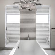 Modern Light Fixture Helps to Create Focal Point in Master Bathroom