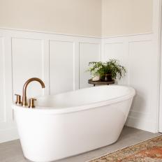 Bathtub Nook Adds a Feeling of Comfort to Neutral Master Bathroom