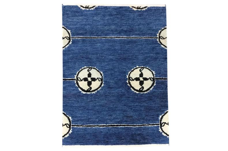 In addition to traditional African patterns, new patterns are being designed by artists and artisans. The Day Rug by AphroChic (https://www.aphrochic.com/) is one such example. The dark blue shade is reflective of indigo design that can be found throughout West Africa, while the pattern is inspired by the designs of the famed African-American craftsman, Thomas Day. The print with a mix of lines and circles feels similar to many of the geometric prints found in traditional indigo print fabrics from the Bamana people of Mali and other West African cultures.  