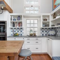 Blue and White Cottage Kitchen With Wood Stool