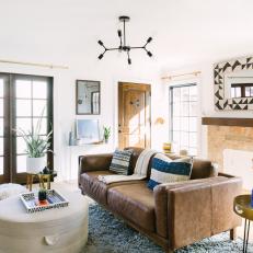 Bright and Stylish Contemporary Living Room With Brown Leather Sofa and Mixed Textures 