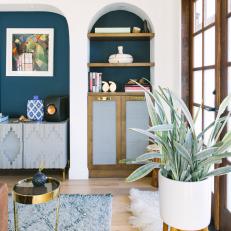 Contemporary Living Room With Mediterranean Influence Featuring Navy Blue Accent Wall 