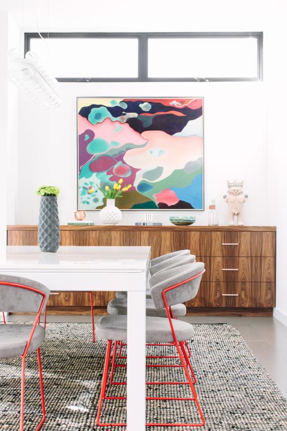 Dining Room With Modern Table And Chairs And Wall Art