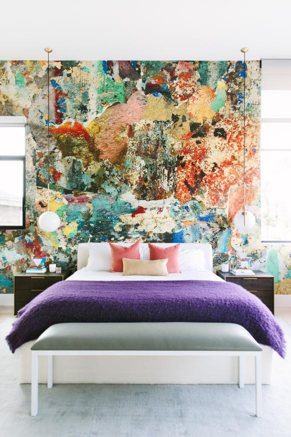 Modern Master Bedroom With Abstract Accent Wall And Colorful Bedding