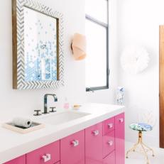 Pink And White Bathroom With Modern Single Sink Vanity And Accessories