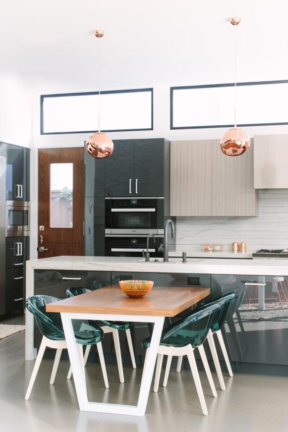 Modern Kitchen With Work Island And Dining Table With Chairs