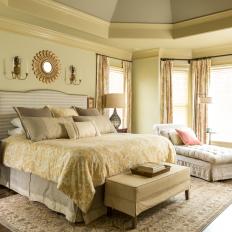Bright Neutral Master Bedroom With Vaulted Ceiling And Upholstered Bed And Chaise Lounge