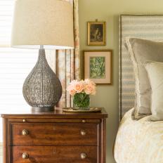Contemporary Master Bedroom Detail With Antique Bedside Table And Modern Lamp