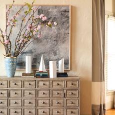 Living Room Detail With Contemporary Multiple Drawer Sideboard And Modern Art