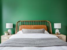 Green Wall Provides Nice Contrast to Warm Wood Headboard