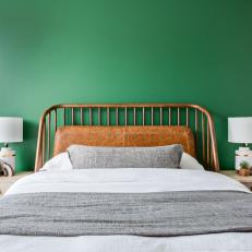 Wood Midcentury-Modern Headboard Stands Out Against Green Wall