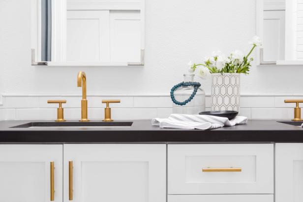 White Bathroom Vanity Dressed Up With Gold-Colored ...
