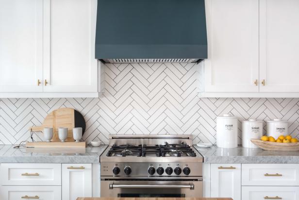 White Kitchen With Blue-Gray Range Hood