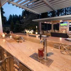 Contemporary Outdoor Kitchen With Concrete Bar With Beer Tap