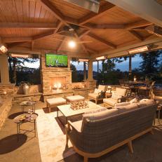 Contemporary Outdoor Covered Living Room With Seating And TV
