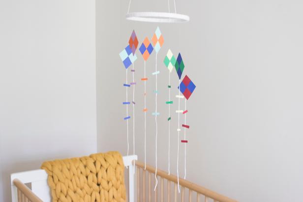 A sweet, colorful diy kite mobile to decorate your child's bedroom or baby's nursery.