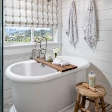 Coastal Master Bathroom with White Oval Freestanding Tub
