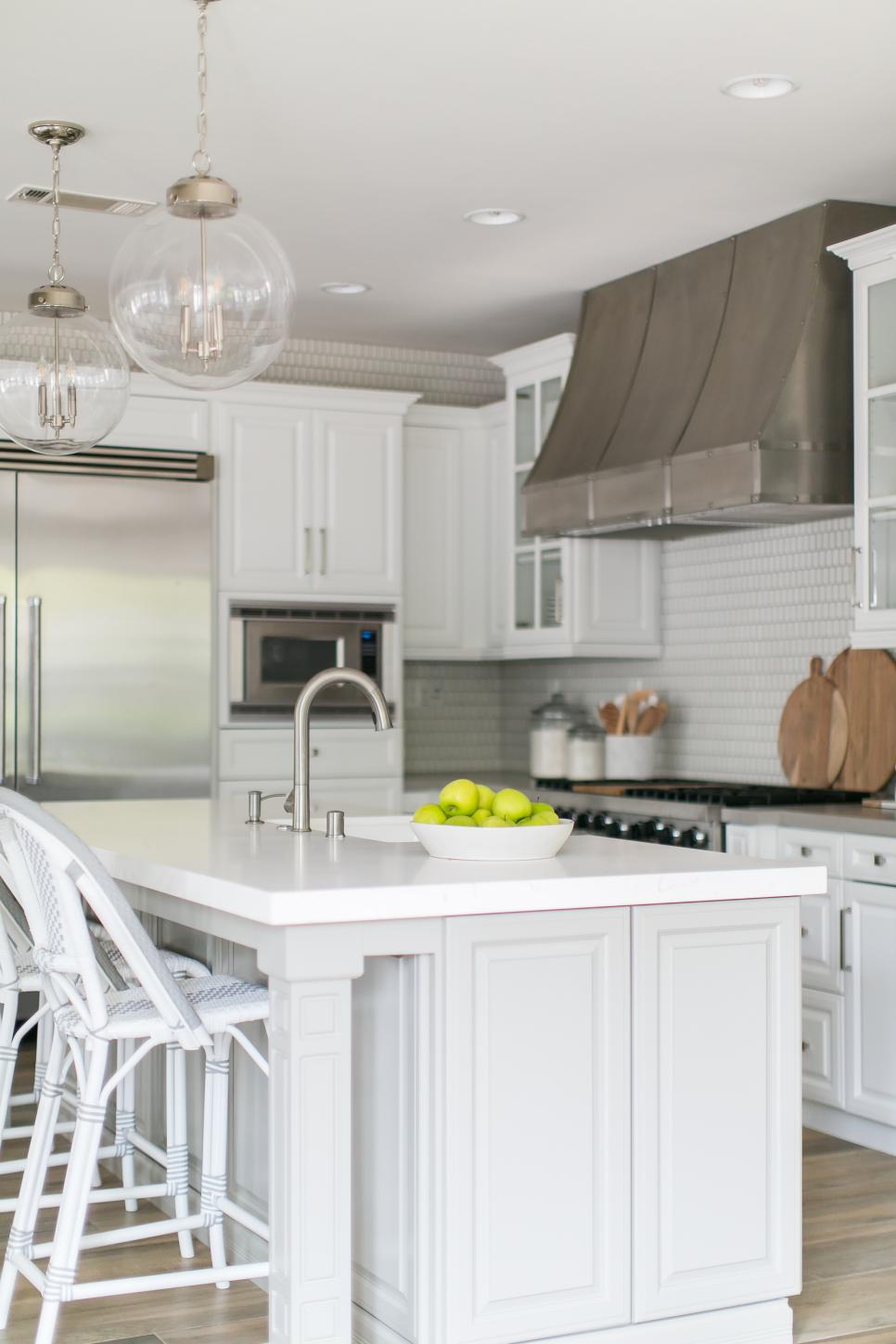 Contemporary White Kitchen With Work Island And Modern Appliances And ...