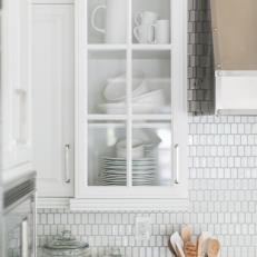 Contemporary White Kitchen Cabinet With Tile Backsplash And Stainless Vent Hood