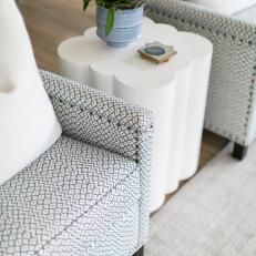 Contemporary Living Room Detail With Upholstered Arm Chairs and Modern End Table