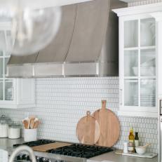 Contemporary White Kitchen With Stainless Vent Hood And Tile Backsplash