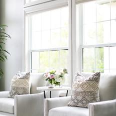 Contemporary White Living Room Detail With Arm Chairs And Side Table
