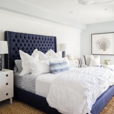 Contemporary White Bedroom With Blue Tufted Upholstered Headboard And White Accents