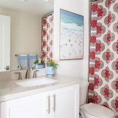 Contemporary White Bathroom With Red And Blue Shower Curtain Accents