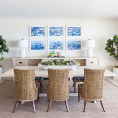 Contemporary White Dining Room With Woven Dining Chairs And Blue Accents