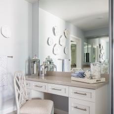 Contemporary White Built In Vanity With Neutral Upholstered Chair