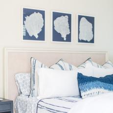 Contemporary White Bedroom With Blue And White Linens And Upholstered Headboard