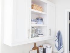 White Kitchen Cabinet With Open Shelves And Neutral Countertop