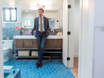 Drew Scott in the renovated master bathroom, which features striking floor tiles, as seen on Brother vs. Brother.