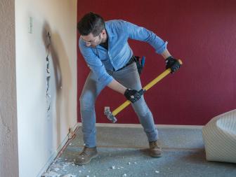 In order to open up the space, host Jonathan Scott uses a sledgehammer to knock down a wall between the master bedroom and a hallway, as seen on Brother vs Brother (action).