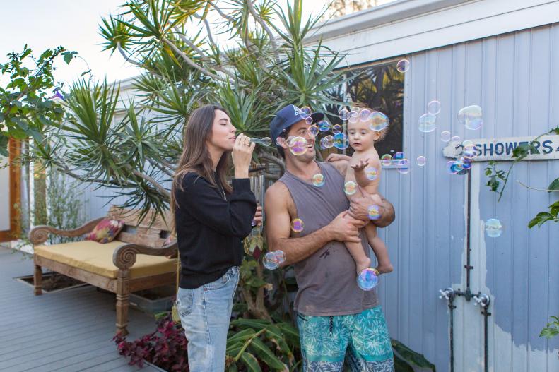 Rachel, Patrick and baby Max outside their luxe Malibu mobile home.
