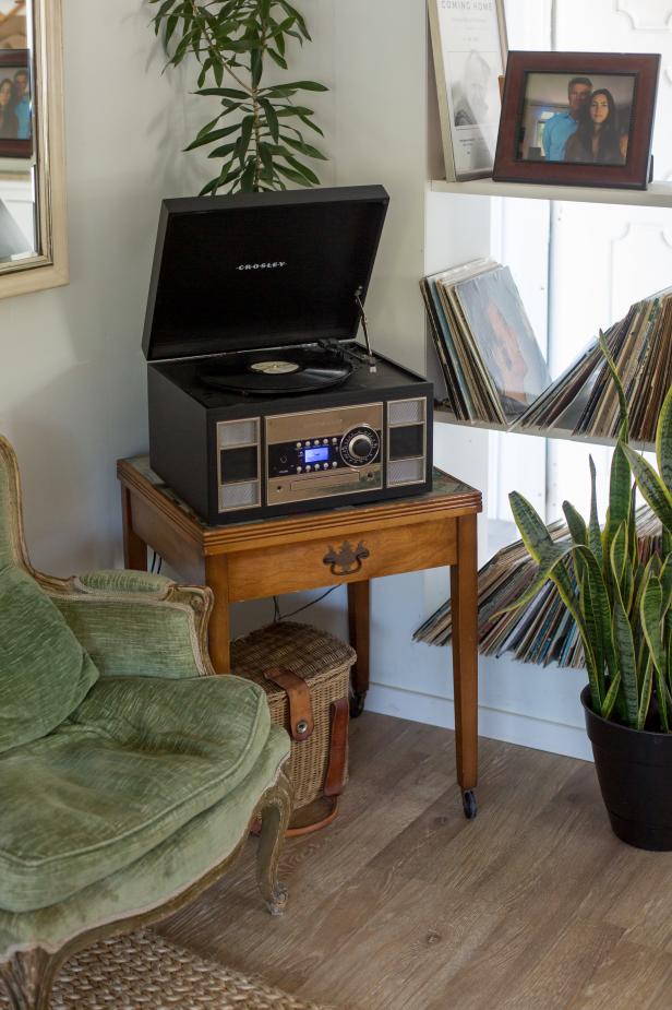 Vintage records and a Crosley record player create a fun, retro entertainment center, which Rachel calls the "funk zone" in her home.