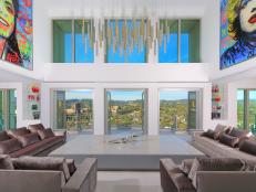 A large, modern living room that highlights the urban views. 