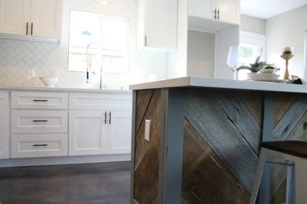 Adding reclaimed wood to the island gives a unique look to this kitchen in Costa Mesa, CA as seen on HGTV's Flip or Flop. (After)