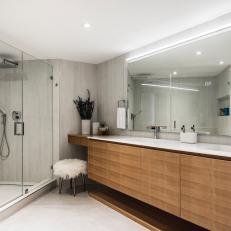 Modern Neutral Condo Bathroom With Double Vanity And Glass Shower Enclosure